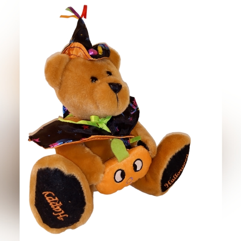 Happy Halloween teddy bear with cape hat pumpkin